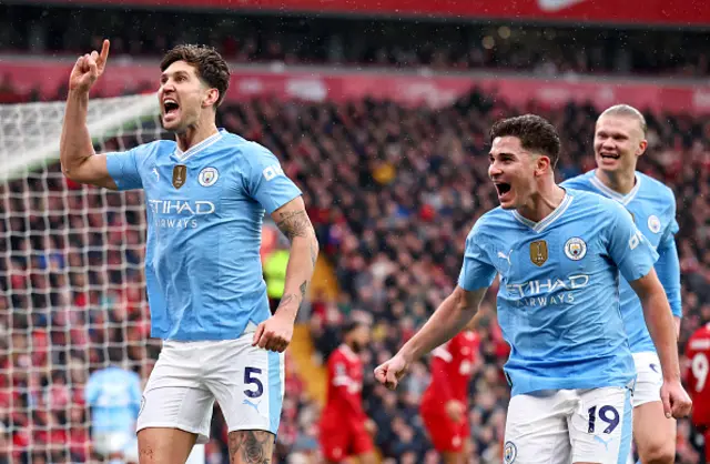 John Stones of Manchester City (L) celebrates scoring