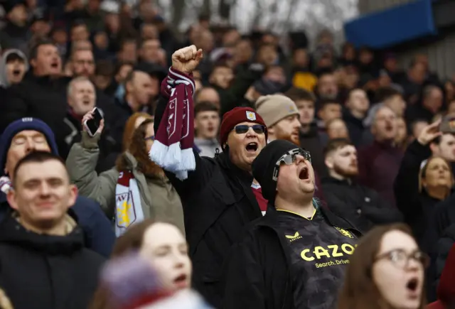 Aston Villa fans react in the stands