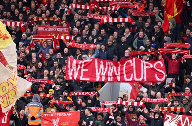 Fans of Liverpool show their support from the stands