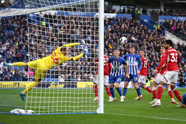 Jan Paul van Hecke of Brighton & Hove Albion has a shot saved by Matz Sels