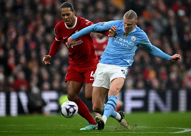 Erling Haaland shoots past Liverpool's Dutch defender Virgil van Dijk