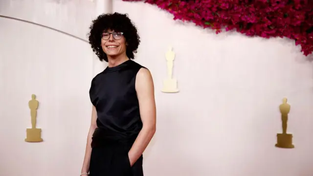 Reece Feldman poses on the red carpet during the Oscars arrivals at the 96th Academy Awards in Hollywood, Los Angeles, California, U.S., March 10, 2024.