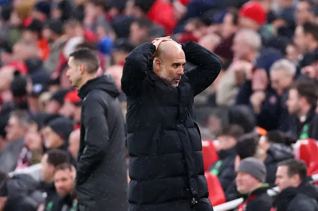 Pep Guardiola, Manager of Manchester City, reacts on the touchline