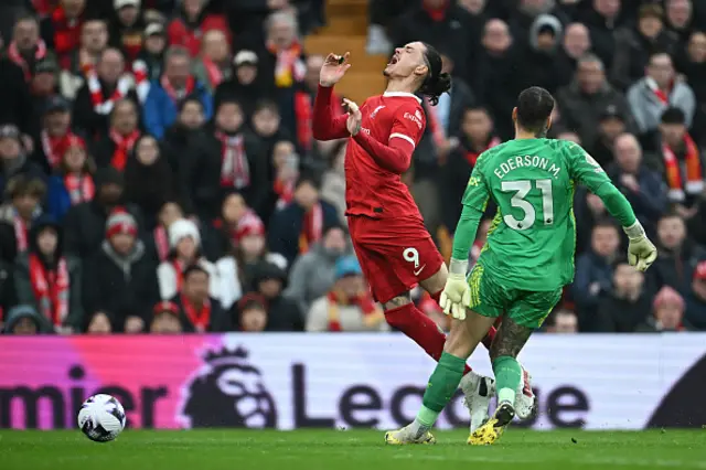 Ederson fouls Liverpool's Uruguayan striker #09 Darwin Nunez