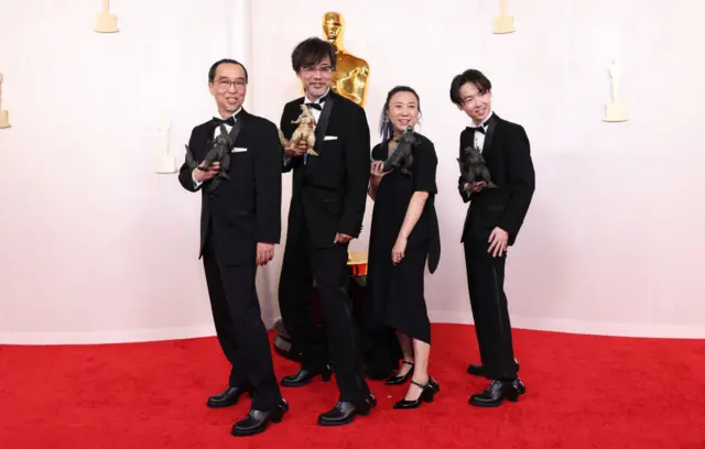 Masaki Takahashi, Takashi Yamazaki, Kiyoko Shibuya and Tatsuji Nojima at the 96th Annual Oscars held at at the Ovation Hollywood on March 10, 2024 in Los Angeles, California