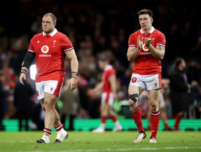 Corey Domachowski and Josh Adams of Wales applaud the fans