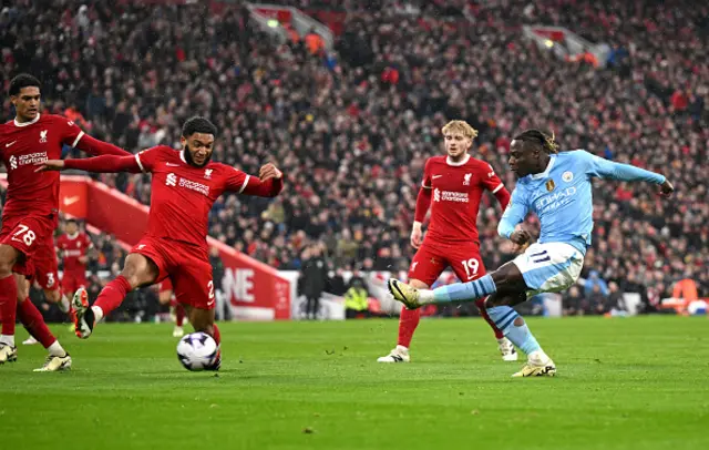 Jeremy Doku of Manchester City shoots and hits the post