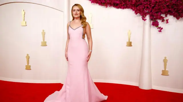 Amelia Dimoldenberg poses on the red carpet during the Oscars arrivals at the 96th Academy Awards in Hollywood, Los Angeles, California, U.S., March 10, 2024.