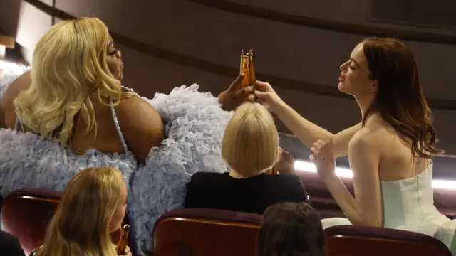 Da'Vine Joy Randolph and Emma Stone toast