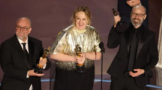 Nadia Stacey, Mark Coulier and Josh Weston win the Oscar for Best Makeup and Hairstyling for "Poor Things" during the Oscars show at the 96th Academy Awards in Hollywood, Los Angeles, California, U.S., March 10, 2024.