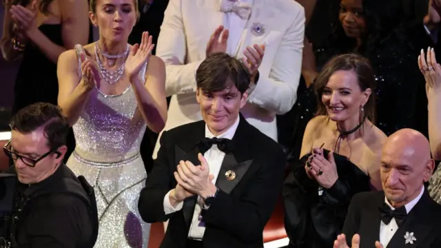 Cillian Murphy applauds as Hoyte van Hoytema wins the Oscar for Best Cinematography for "Oppenheimer" during the Oscars show at the 96th Academy Awards in Hollywood, Los Angeles, California, U.S., March 10, 2024