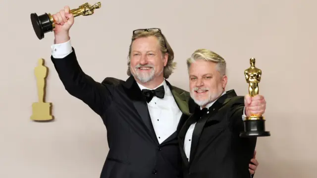 Dave Mullins (L) and Brad Booker, winners of the Best Animated Short Film for 'War is Over! Inspired by the Music of John and Yoko,' hold up their Oscars in the press room during the 96th annual Academy Awards ceremony at the Dolby Theatre in the Hollywood neighborhood of Los Angeles, California, USA, 10 March 2024.