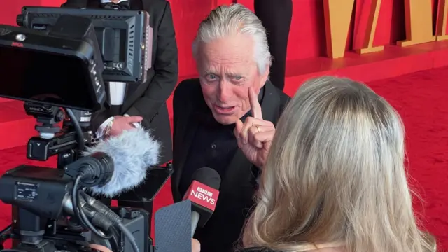 Michael Douglas speaks to the BBC on the red carpet