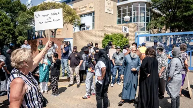 Residents protest outside the offices of Johannesburg Water's Southdale Depot in the south of Johannesburg on March 22, 2023, on World Water Day
