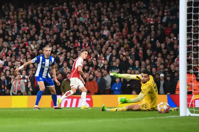 Trossard scores as Costa and Pepe watch on.