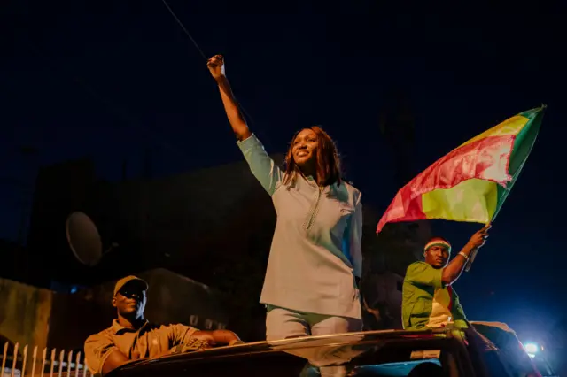 Presidential candidate and founder of the Alternative pour la relève citoyenne (ARC) party, Anta Babacar Ngom waves to supporters in the Hann Mariste district of Dakar on March 11, 2024.