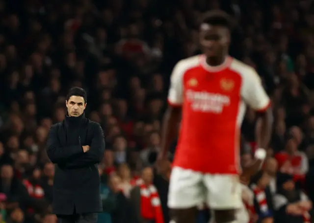 Arteta watches on intently.