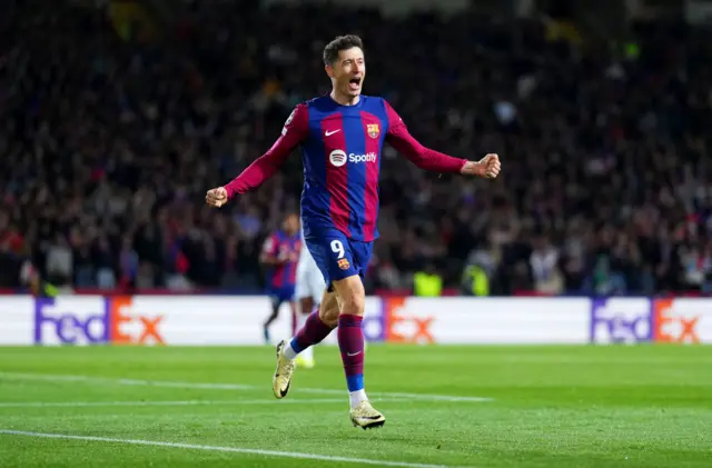 Lewandowski celebrates the third Barcelona goal.