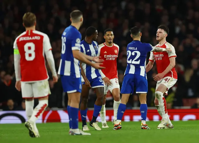 Rice and several Porto players square off.