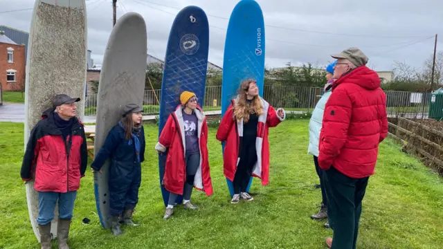 Surfers gathered near the River Severn ready to take on the bore