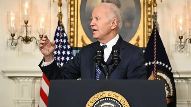 Biden answers questions from reporters in the Diplomatic Reception Room of the White House last month