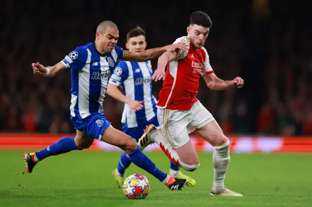 Pepe tackles Rice in midfield.