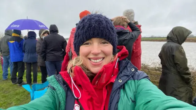 BBC reporter Fiona Lamdin next to the River Severn for the Severn Bore