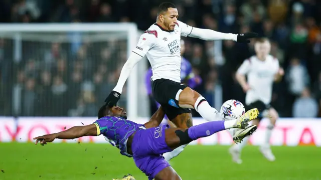 Nathaniel Mendez-Laing of Derby County and Andy Yiadom of Reading