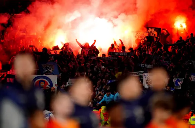 Porto fans set off a flare in the away end.