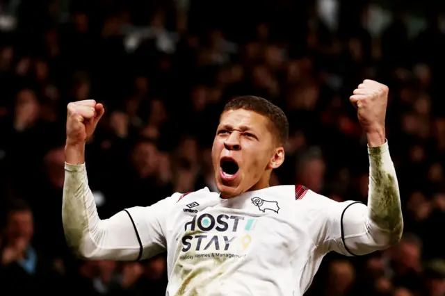 Dwight Gayle celebrates scoring for Derby