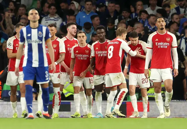 Arsenal players celebrate as Pepe commiserates.