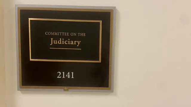 The sign outside the committee chamber