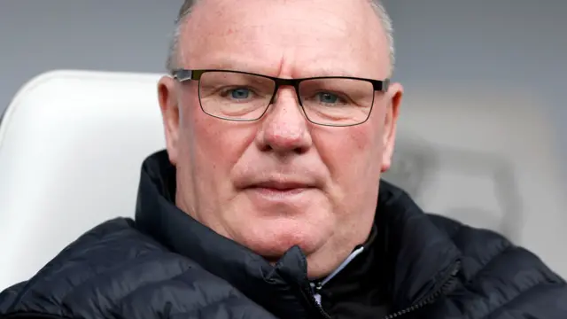 Stevenage manager Steve Evans looks on