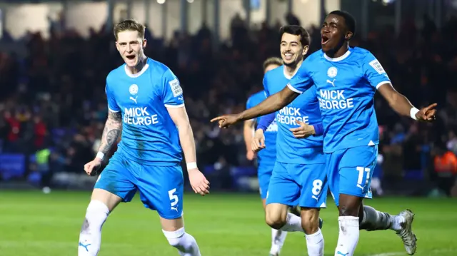 Peterborough celebrate scoring a goal