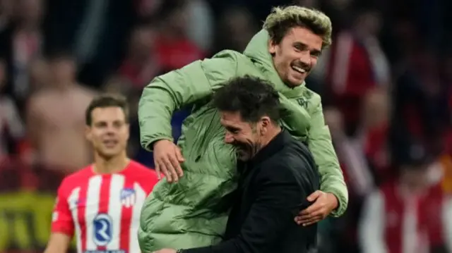 Antoine Griezmann and Diego Simeone.