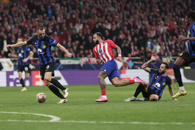 Hakan Calhanoglu brings down Memphis Depay