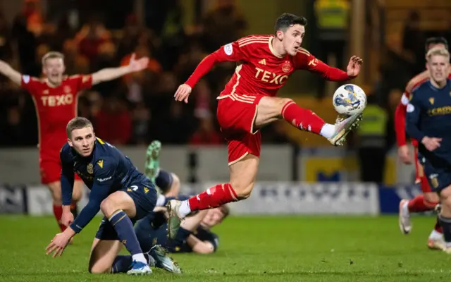 Aberdeen's Jamie McGrath tries to get away from Dundee's Owen Dodgson