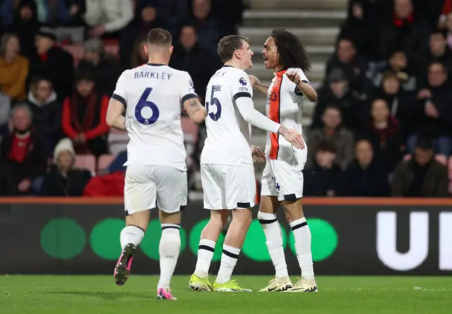 Chong celebrates his goal with teammates.