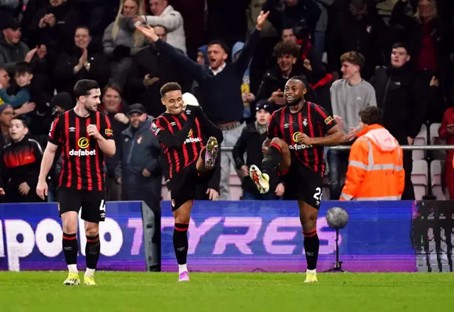 Bournemouth players celebrate their fourth goal.