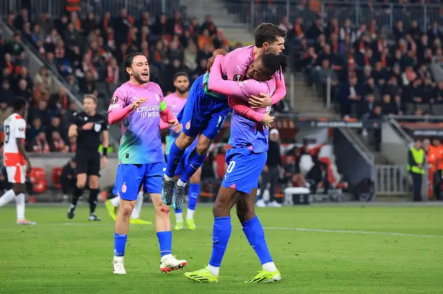 Pulisic and Leao celebrate West Ham's goals.