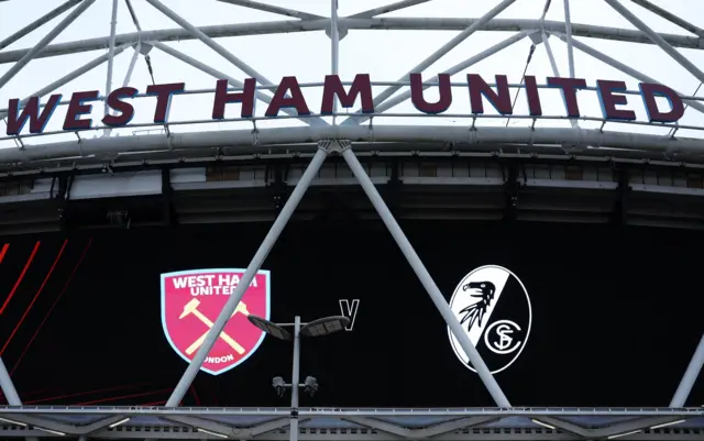 London Stadium facade showing the WHU and FREI crests.