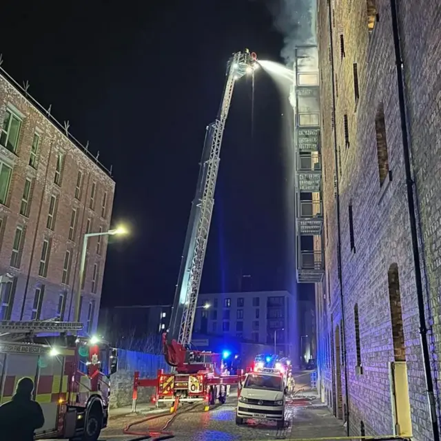 Firefighters doused the flames in the upper floors of the building