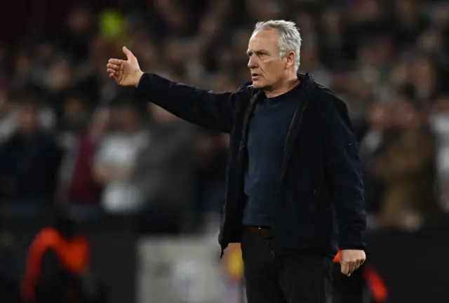 Christian Streich waves instructions to his Freiburg players