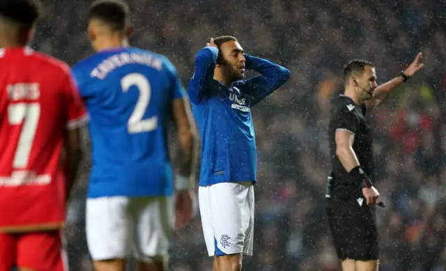 A Rangers player holds his head after a big miss