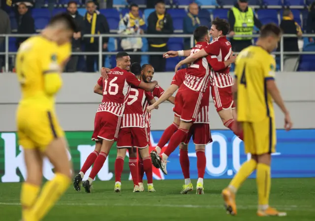 Olympiakos celebrate their goal at Tel-Aviv