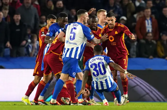 PLayers scuffle in a melee in the box