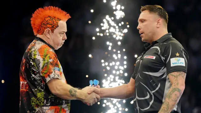 Peter Wright shakes hands with Gerwyn Price