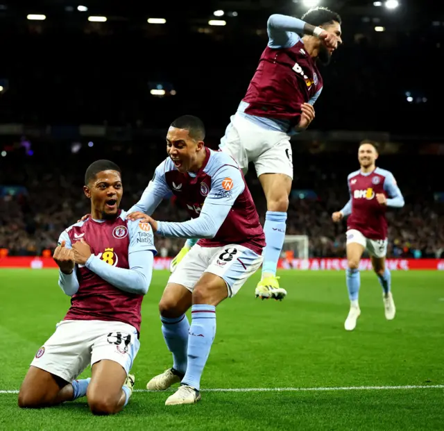 Villa celebrate their fourth goal v Ajax