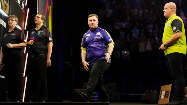 Luke Littler reacts during his match against Michael van Gerwen