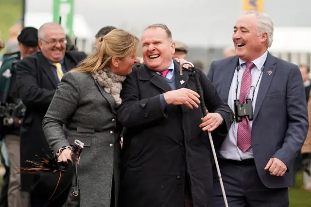 Paisley Park owner Andrew Gemmell (centre) with trainer Emma Lavelle and friend Tom Friel